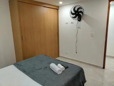 a bedroom with two towels on a bed at Exclusivo Apto lujoso central, sereno y cómodo 302 in Medellín