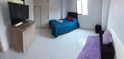 a bedroom with a bed and a flat screen tv at HABITACIÓN PRIVADA tranquila y confortable in Bello