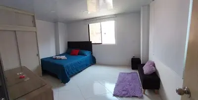 a bedroom with a blue bed and a window at HABITACIÓN PRIVADA tranquila y confortable in Bello