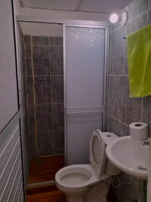 a bathroom with a toilet and a sink at Apartamento Encanto in Puerto Triunfo