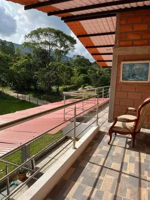 a deck with a chair on a house at La Clarita in San Rafael