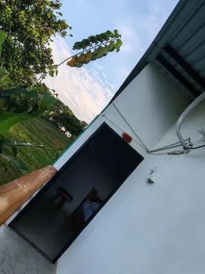 a large window on the side of a house at Finca Campestre La Flor in Doradal