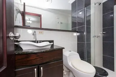 a bathroom with a sink and a toilet and a shower at ¡Apartamento HOME LAURELES excelente ubicación! in Medellín