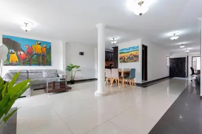 a living room with a couch and a table at ¡Apartamento HOME LAURELES excelente ubicación! in Medellín