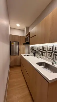 a kitchen with a sink and a counter top at M de oro Apartamentos Muuk boutique POBLADO in Medellín