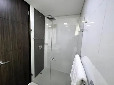 a bathroom with a shower with a glass door at 501 Luxury Apartment In Heart Of El Poblado in Medellín