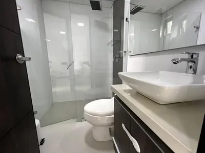 a bathroom with a sink and a toilet and a shower at 501 Luxury Apartment In Heart Of El Poblado in Medellín