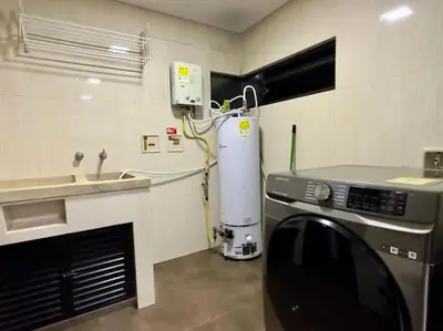a kitchen with a washing machine and a sink at 1401, Luxury Penthouse In El Poblado in Medellín