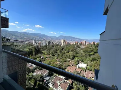 a view of a city from the balcony of a building at 1202, Central Apartment in El Poblado + View in Medellín