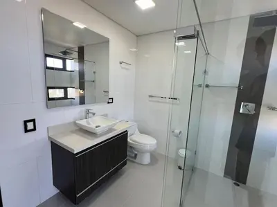 a bathroom with a toilet and a sink and a shower at 1202, Central Apartment in El Poblado + View in Medellín