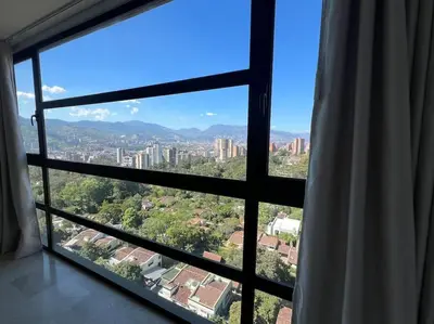 a view of a city from a window at 1202, Central Apartment in El Poblado + View in Medellín