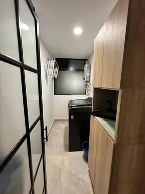 a small kitchen with a sink and a refrigerator at Aluna Apto/ Wellness and Enjoy in Sabaneta
