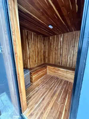 an empty sauna with a wooden floor and wooden walls at Aluna Apto/ Wellness and Enjoy in Sabaneta