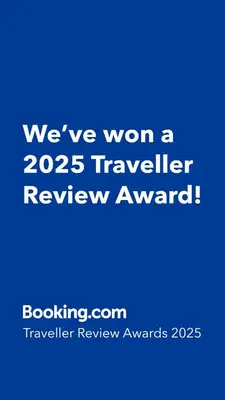 a blue sign that says weve won a traveler review award at Aluna Apto/ Wellness and Enjoy in Sabaneta