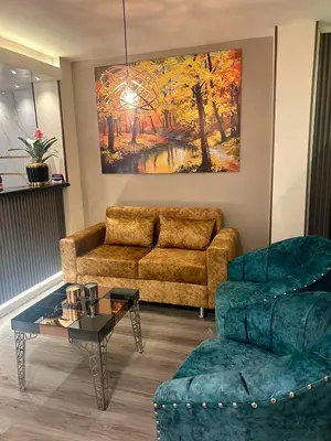 a living room with a couch and a table at Provenza Medellin Hotel Boutique in Medellín