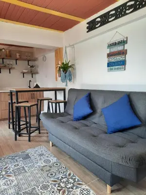 a living room with a couch and a table at Apartamento Corona in Confines