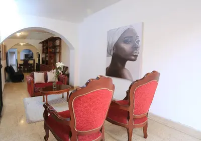 a bust of a woman sitting on a table in a living room at Familiar y acogedor in Medellín