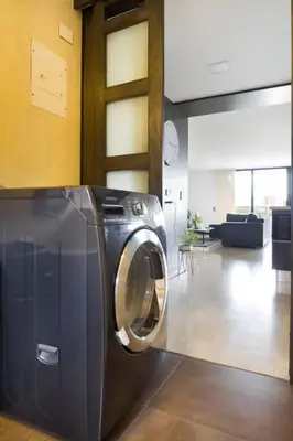 a washing machine sitting in a living room at 301 Modern space in exclusive area of El Poblado in Medellín
