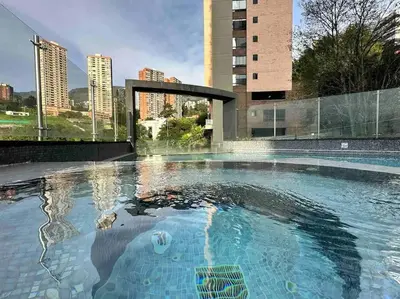 an empty swimming pool in a building with buildings at 302 Spacious apartment nice view in El Poblado in Medellín