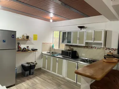 a kitchen with white cabinets and a counter top at Las 5 Quintas - Acogedora casa in San Rafael