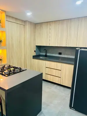 a kitchen with a stove and a counter top at Torre Meraki in Medellín