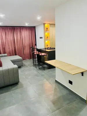 a living room with a couch and a table at Torre Meraki in Medellín