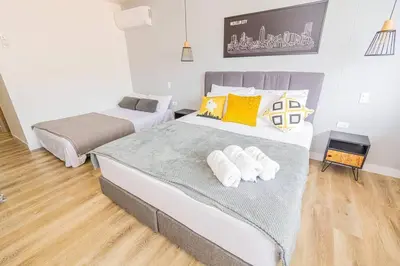 a bedroom with two beds in a room at Bright Studio Topfloor A/C, Poblado Coworking1412 in Medellín