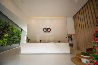 a lobby with a white counter in a building at Bright Studio Topfloor A/C, Poblado Coworking1412 in Medellín
