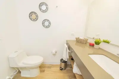 a bathroom with a toilet and a sink at Poblado, Modern studio, coworking, A/C, Gym 1411 in Medellín