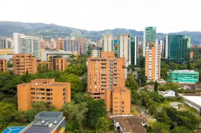 a city skyline with tall buildings and trees at Poblado, Modern studio, coworking, A/C, Gym 1411 in Medellín