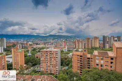 an aerial view of a city with tall buildings at Cozy studio in Poblado, parking, NO FEE 1107 in Medellín