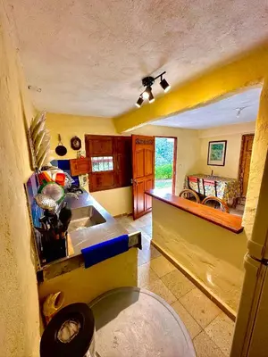 a kitchen with a sink and a counter top at Wayra Ecolodge in El Peñol