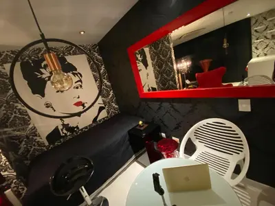 a room with a table with a laptop and a mirror at Blux 1305 Poblado Medellín Colombia in Medellín