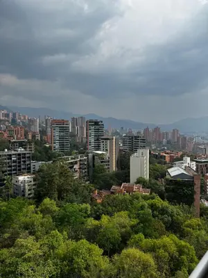 a view of a city with trees and buildings at Blux 1305 Poblado Medellín Colombia in Medellín