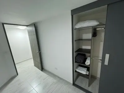 a room with an open door to a room with a closet at Comodo y amplio apartamento en Laureles in Medellín