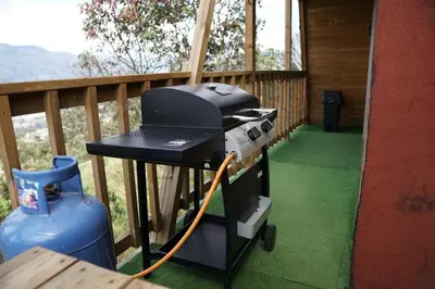 a grill sitting on a table on a porch at Chalet El Pinal - Copacabana in Copacabana