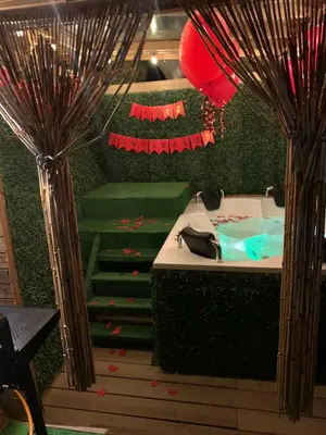 a bathroom with a sink and a staircase with red balloons at Chalet El Pinal - Copacabana in Copacabana