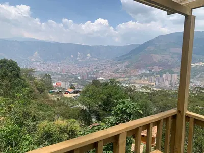 a view of a city from the balcony of a house at Chalet El Pinal - Copacabana in Copacabana
