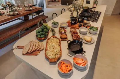 a table with many different types of food on it at Casa Selva, a unique luxury house in the heart of El Poblado in Medellín