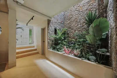 an indoor aquarium in the hallway of a house at Casa Selva, a unique luxury house in the heart of El Poblado in Medellín