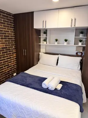 a bedroom with a bed with two towels on it at 2211 Despierta en poblado Medellín - Vista panorámica in Medellín