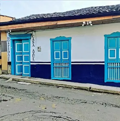 a blue and white building with blue windows at Hotel Casa Azul in Sonsón