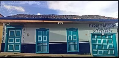 a building with blue and white paint on it at Hotel Casa Azul in Sonsón