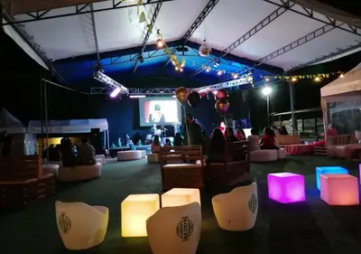 a room with a stage with chairs and lights at Hotel Chalet en montaña Manizales in Villamaría