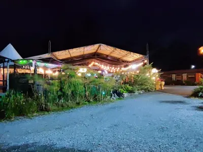 a building with lights on it at night at Hotel Chalet en montaña Manizales in Villamaría