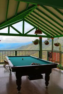 a pool table in a room with a view at Finca Hotel Isla del Encanto in Támesis