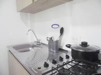 a kitchen stove with a pot on top of it at Apt#202 Descanso familiar en apartamentos vacacionales Bethel in Doradal