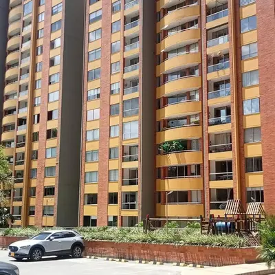 a car parked in front of a large building at El Poblado, Medellín con Piscina, gym, cómodo, linda vista. in Medellín