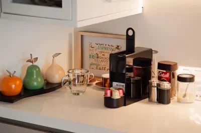 a kitchen counter with a coffee maker and a blender at Luxury El Poblado Loft, relax in Medellin's heart! in Medellín