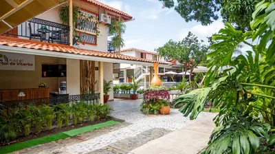 a courtyard of a house with plants at HOTEL PORTAL DE VITERBO Y RESTAURANTE LA FONDA in Viterbo